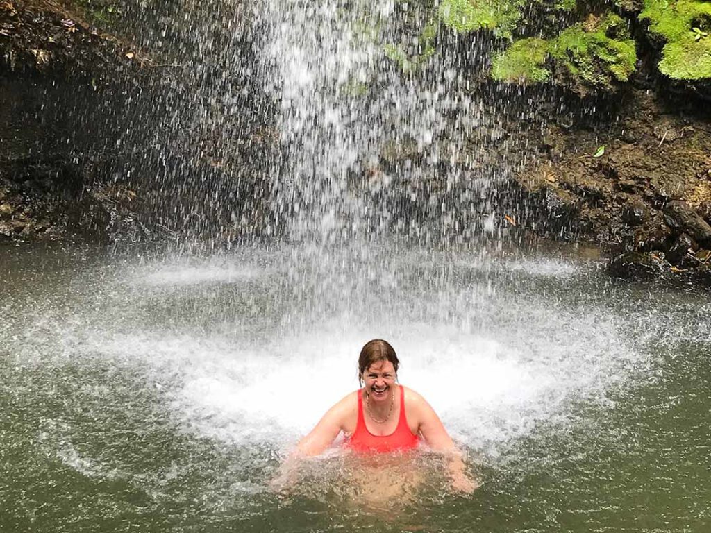 Bathing under Toraille Waterfall