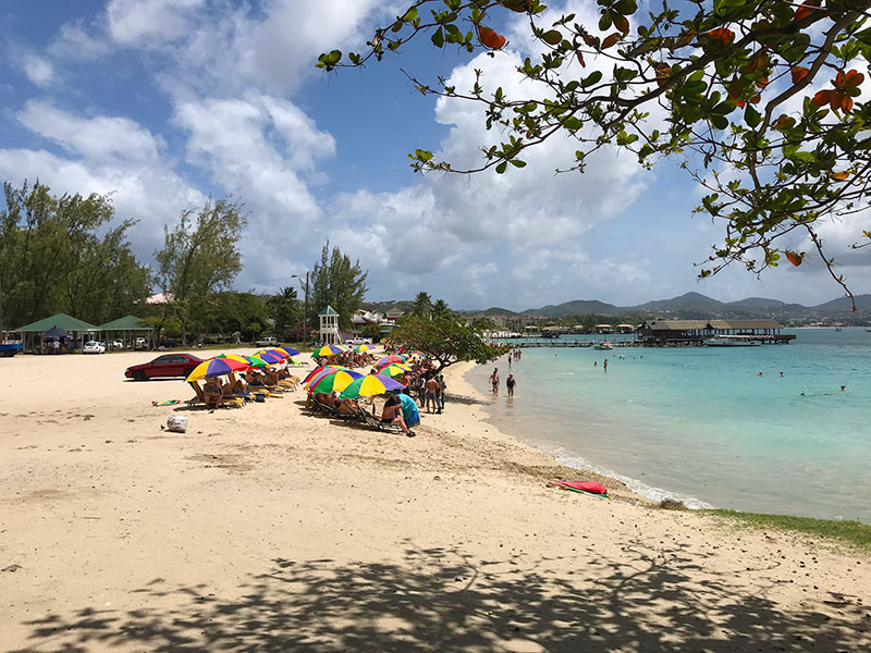 Pigeon Island Beach: Guests relaxing under beach umbrellas.