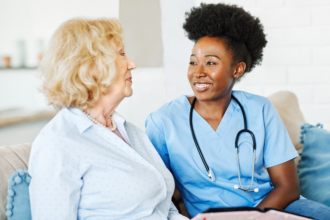 A nurse with traveler talking